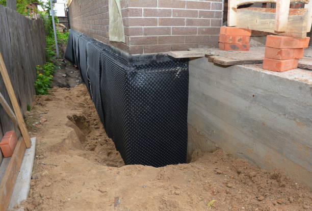 SJ Waterproofing Pros technician performing targeted Wet Basement Repair assessment in Morristown, TN
